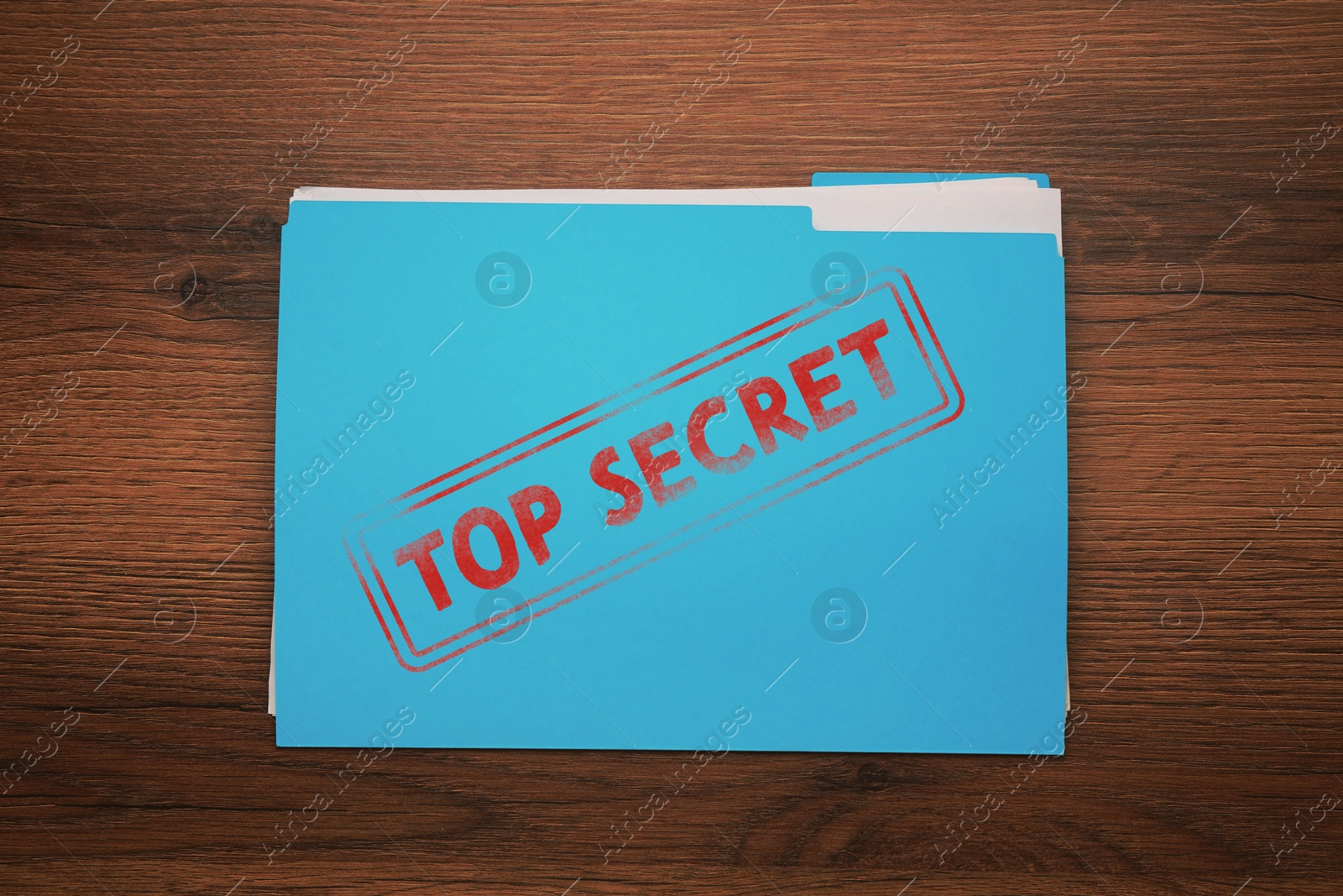 Image of Light blue file with documents and Top Secret stamp on wooden table, top view