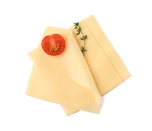 Photo of Slices of tasty fresh cheese, thyme and tomato isolated on white, top view