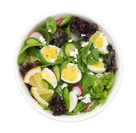 Photo of Delicious salad with boiled eggs, vegetables and lemon in bowl isolated on white, top view
