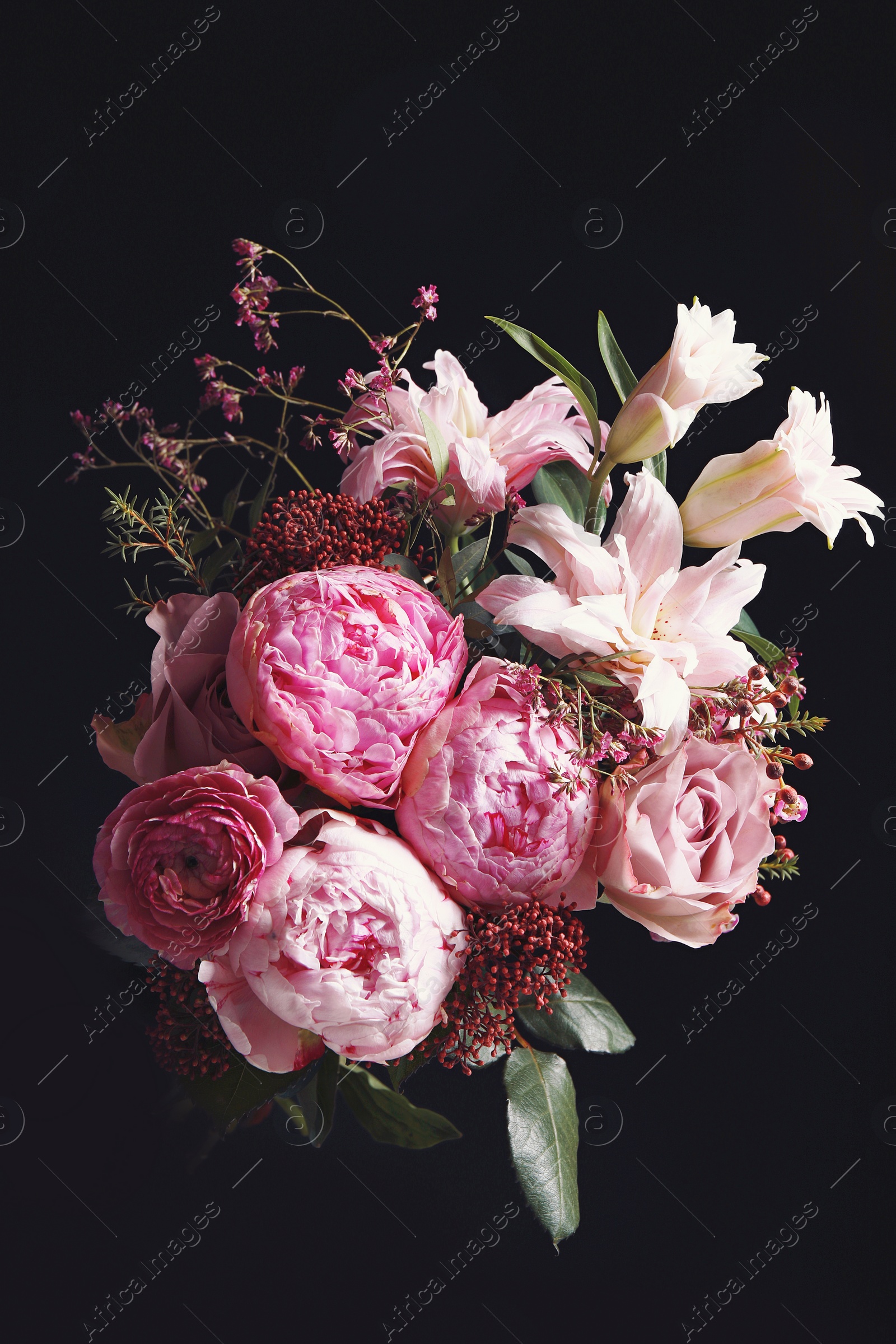 Photo of Beautiful bouquet of different flowers on black background. Floral card design with dark vintage effect