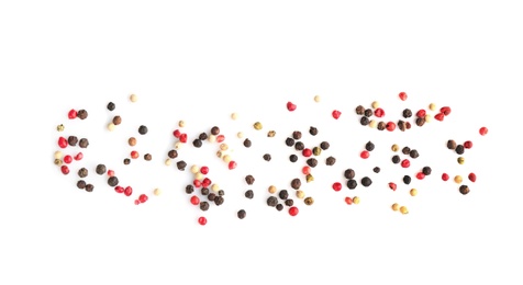 Mix of different pepper grains on white background, top view