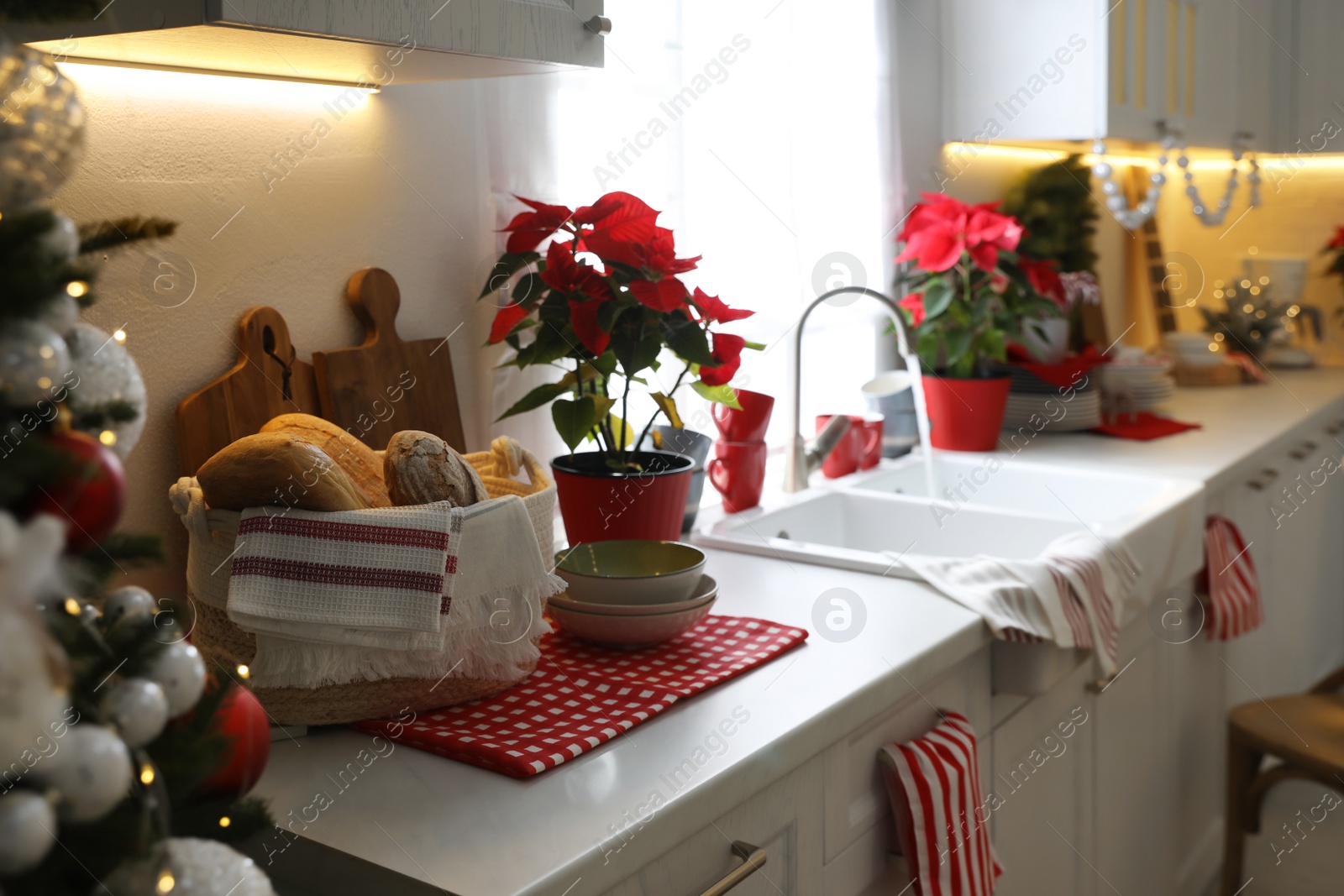 Photo of Kitchen counter with dishware and Christmas decor