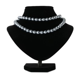 Photo of Stylish pearl necklace on jewelry bust against white background