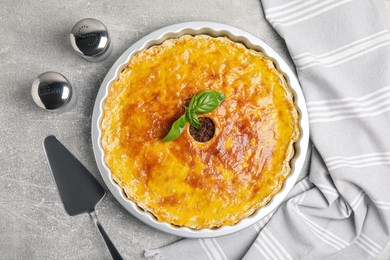 Photo of Delicious pie with minced meat on light grey table, flat lay