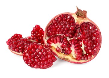 Photo of Fresh cut pomegranate with juicy seeds isolated on white