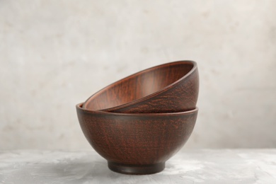 Photo of Clay bowls on grey table. Handmade utensil