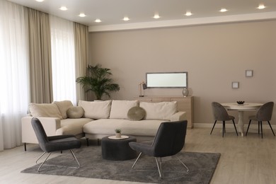 Photo of Stylish living room interior with modern furniture