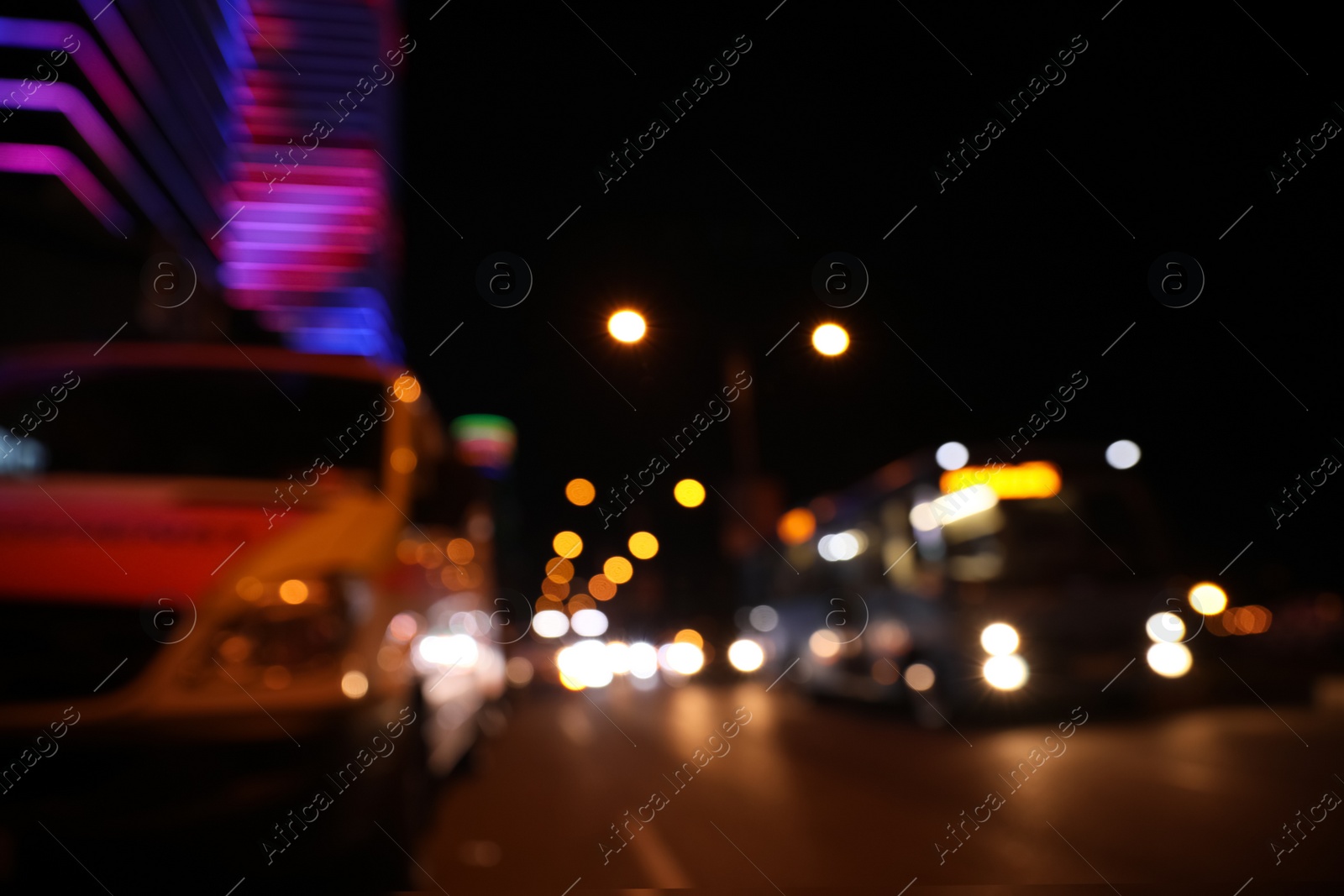 Photo of Blurred view of cityscape with bokeh effect. Night life