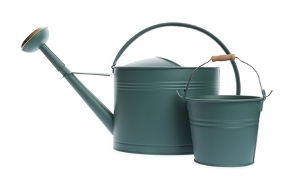 Photo of Watering can and bucket on white background