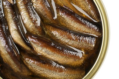 Photo of One tin can of sprats isolated on white, top view