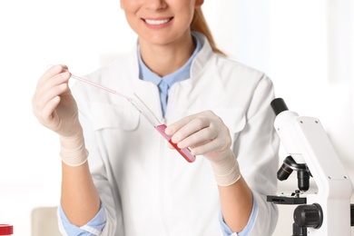 Photo of Scientist working in laboratory, closeup. Research and analysis