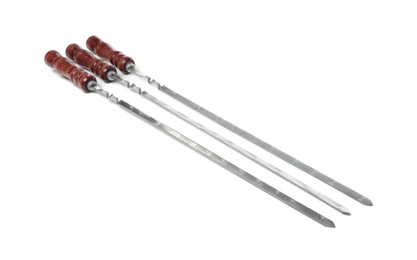 Photo of Metal skewers with wooden handle on white background