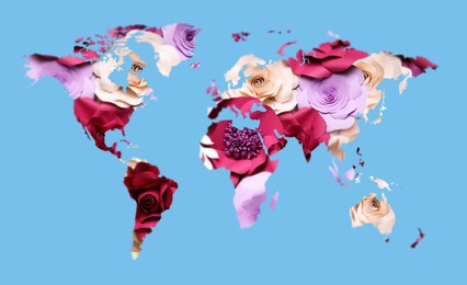 Image of World map made of beautiful flowers on light blue background, banner design