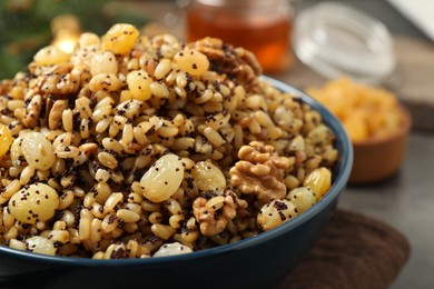 Photo of Traditional Christmas slavic dish kutia in bowl, closeup