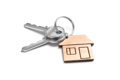 Photo of House keys with trinket on white background
