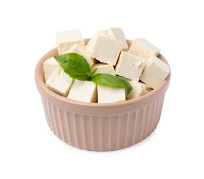 Photo of Delicious tofu cheese and basil isolated on white