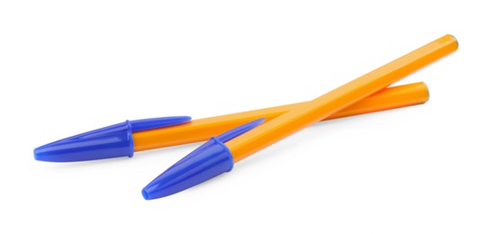 Photo of New orange plastic pens isolated on white