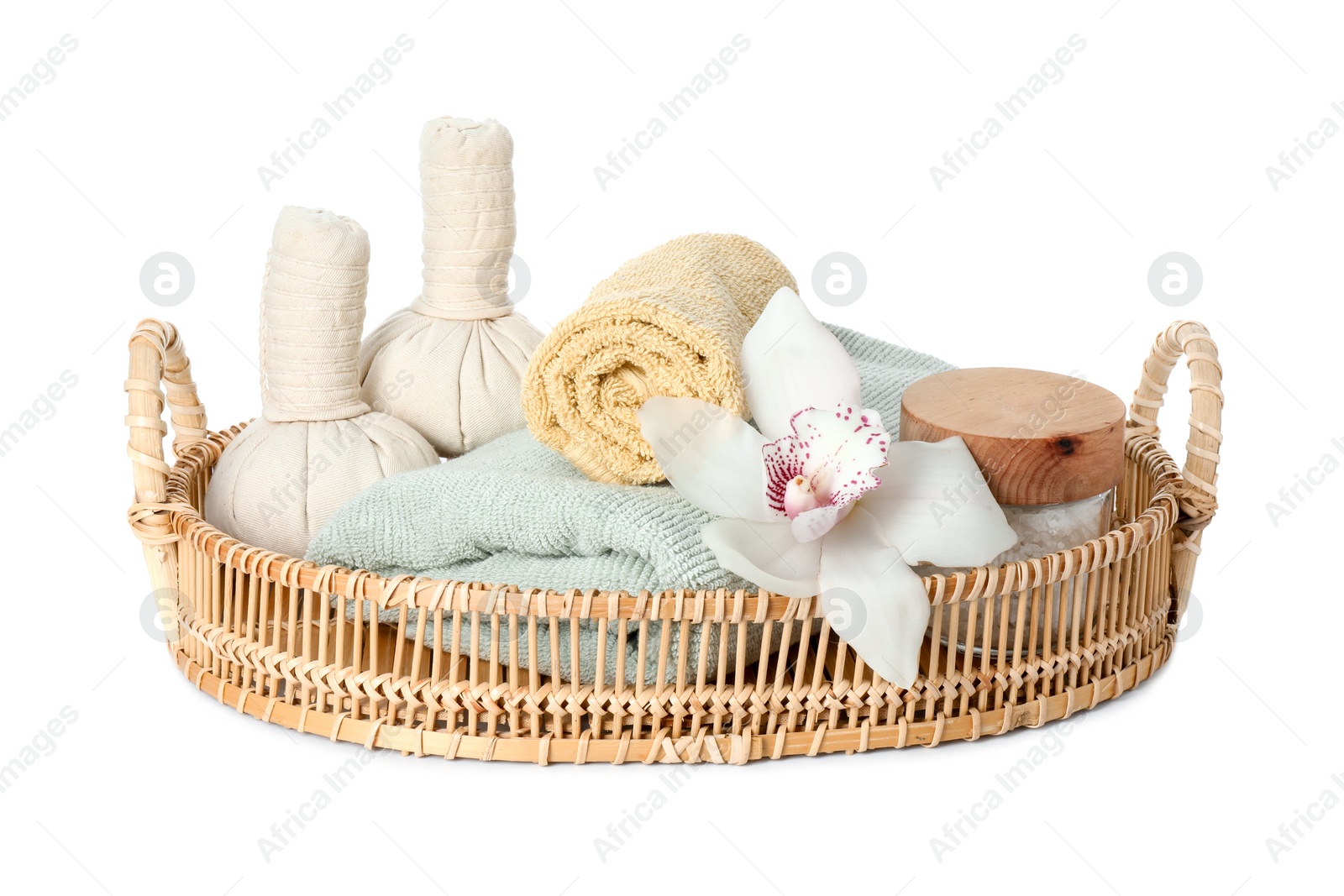 Photo of Spa composition. Towels, herbal massage bags, sea salt and beautiful flower on white background