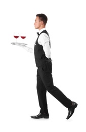 Photo of Waiter holding metal tray with glasses of wine on white background