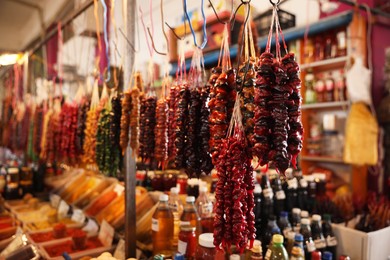 Photo of Bunches of different delicious churchkhelas at market, space for text