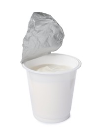 Photo of Plastic cup with delicious organic yogurt isolated on white