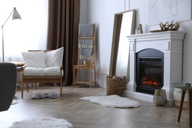 Photo of Beautiful living room interior with fireplace and armchair