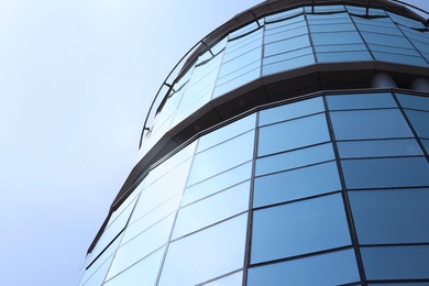 Photo of Building with tinted windows, outdoors. Modern architectural design