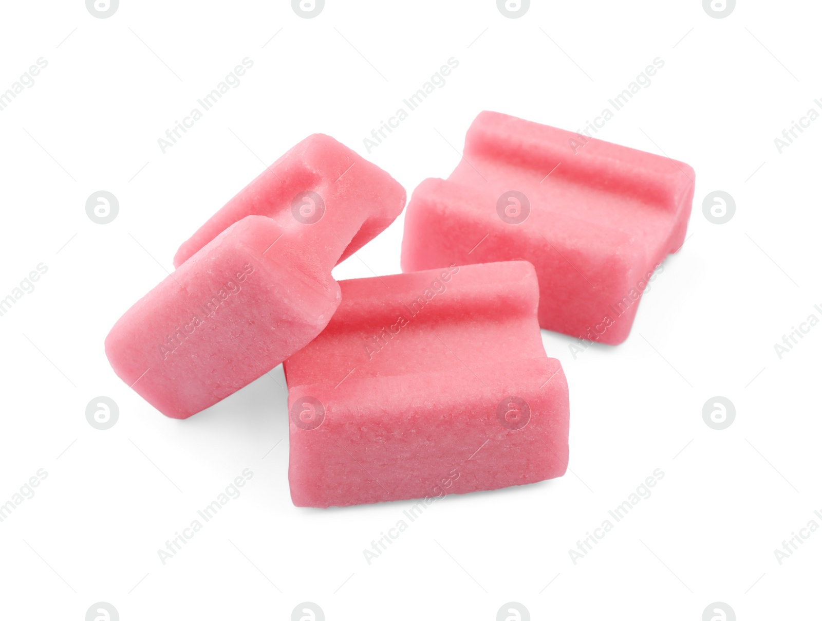 Photo of Tasty pink chewing gums on white background