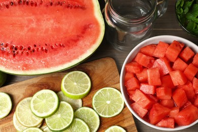 Fresh ingredients for making watermelon drink with lime on wooden table, above view