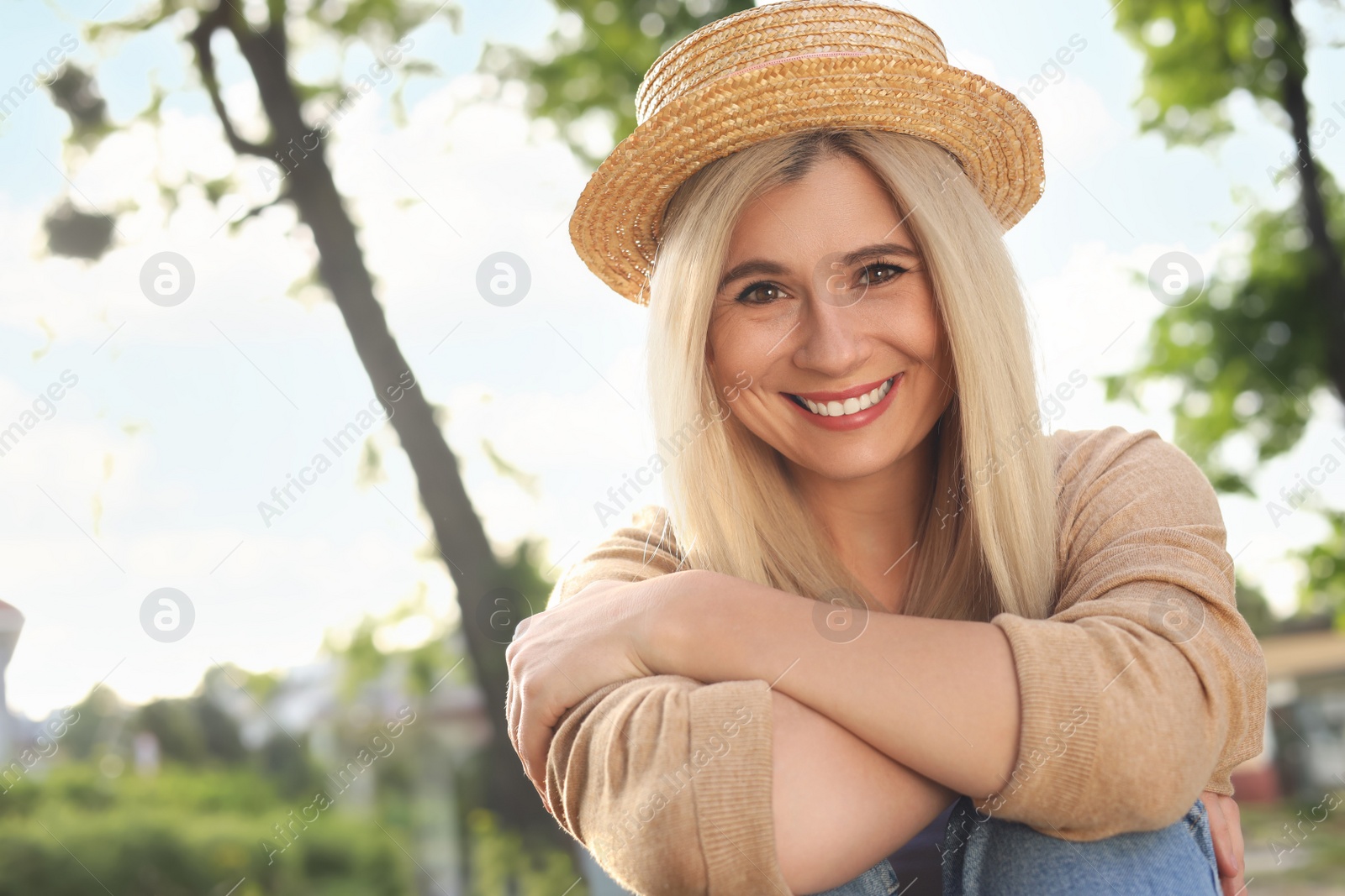 Photo of Portrait of beautiful woman in straw hat outdoors on sunny day