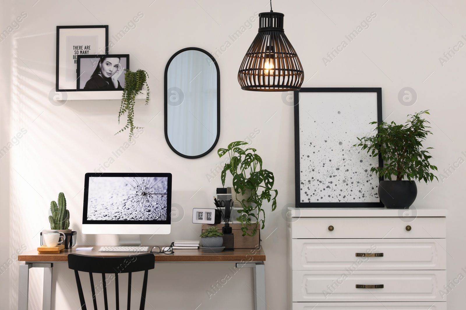 Photo of Cozy workspace with computer on wooden desk at home