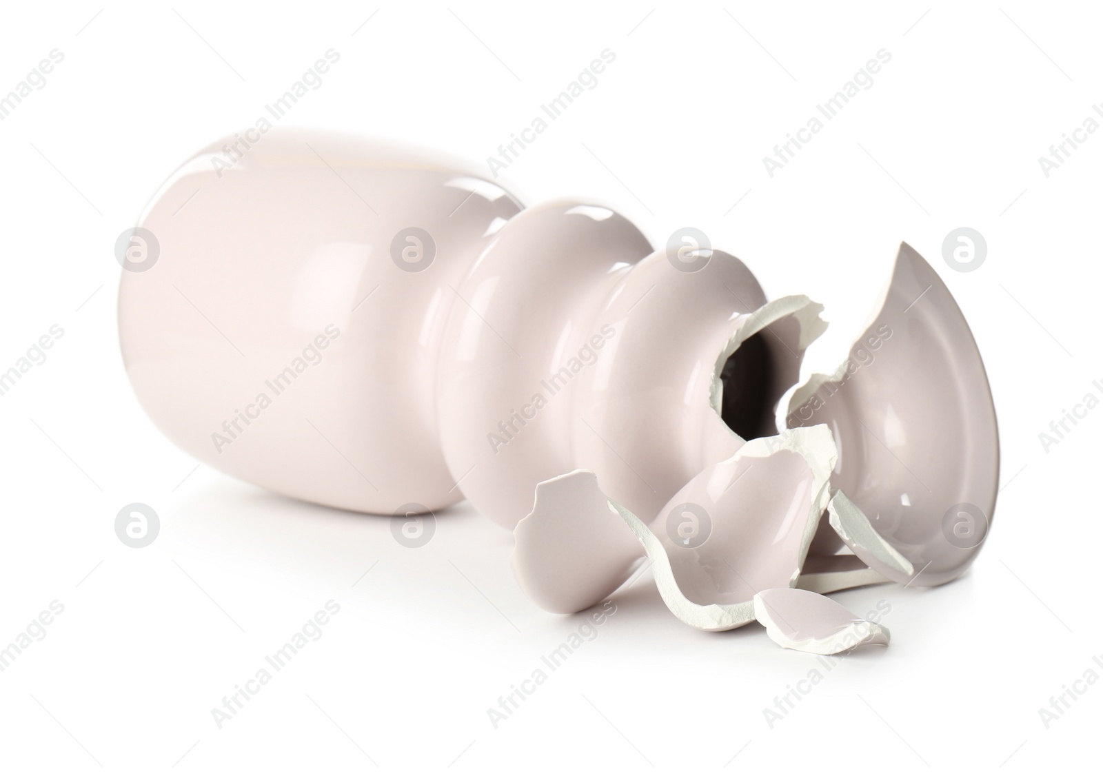 Photo of Broken pink ceramic vase isolated on white
