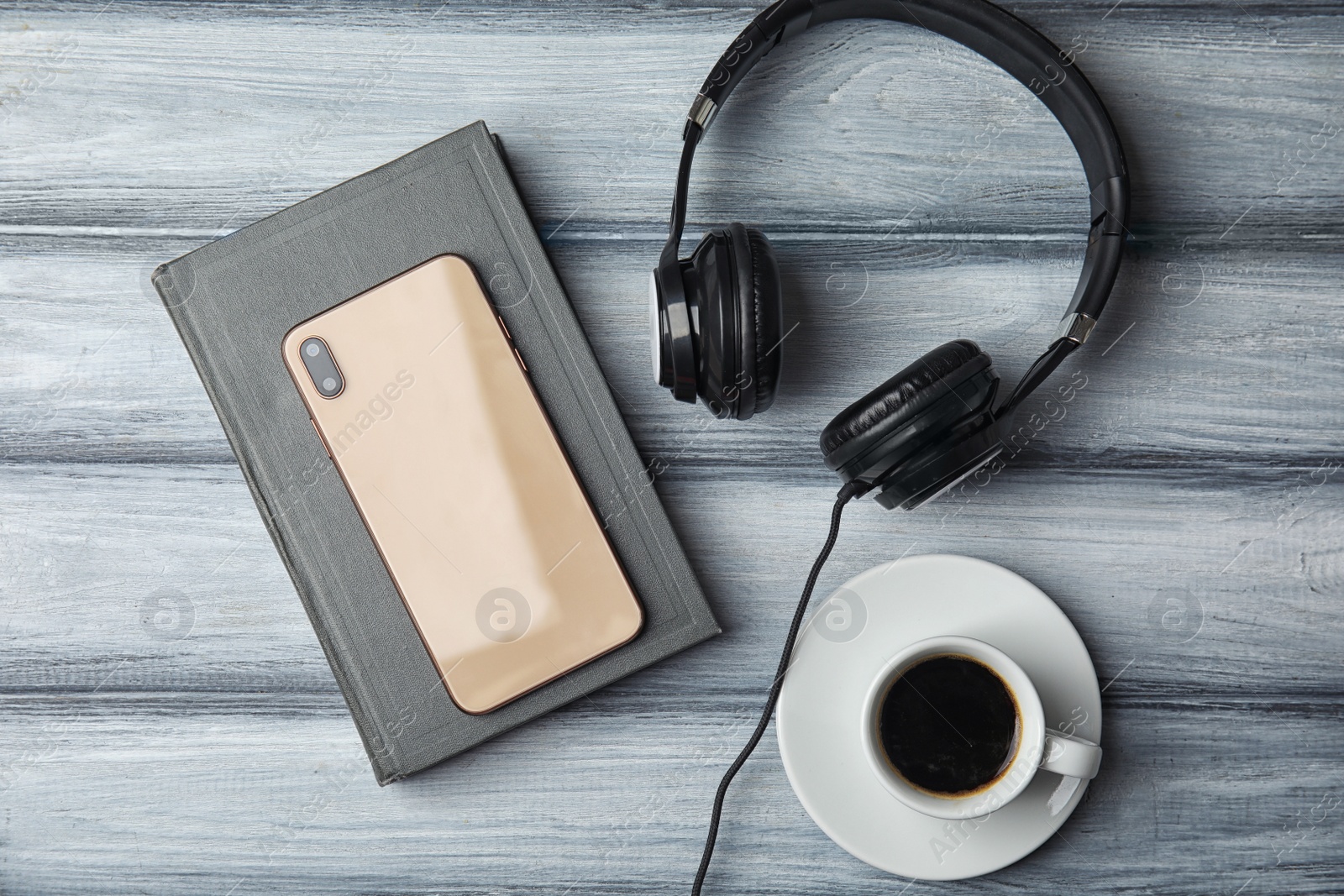 Photo of Flat lay composition with book on white wooden table