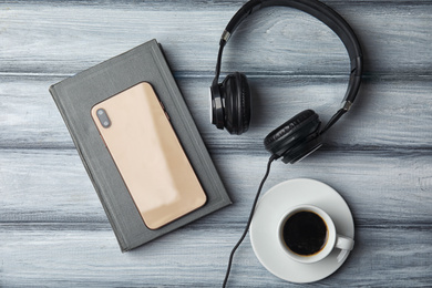 Flat lay composition with book on white wooden table