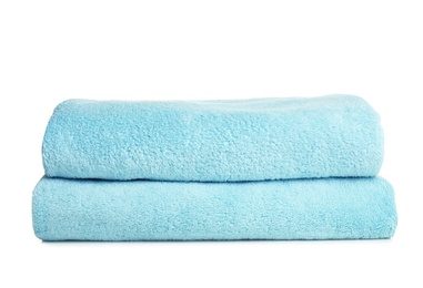 Folded soft terry towels on white background