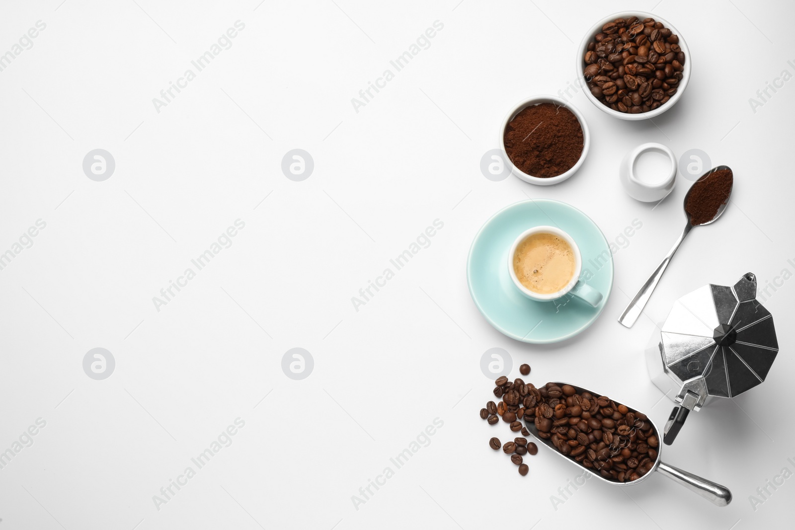 Photo of Flat lay composition with coffee grounds and roasted beans on white background, space for text