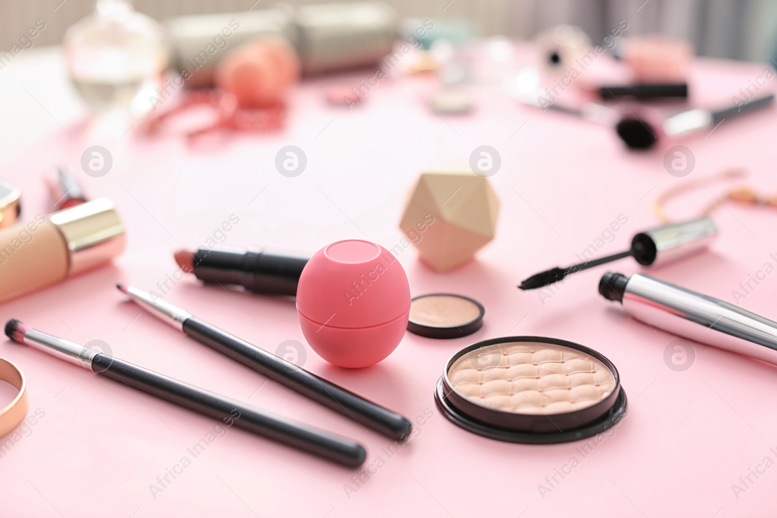 Photo of Makeup products for woman on color background