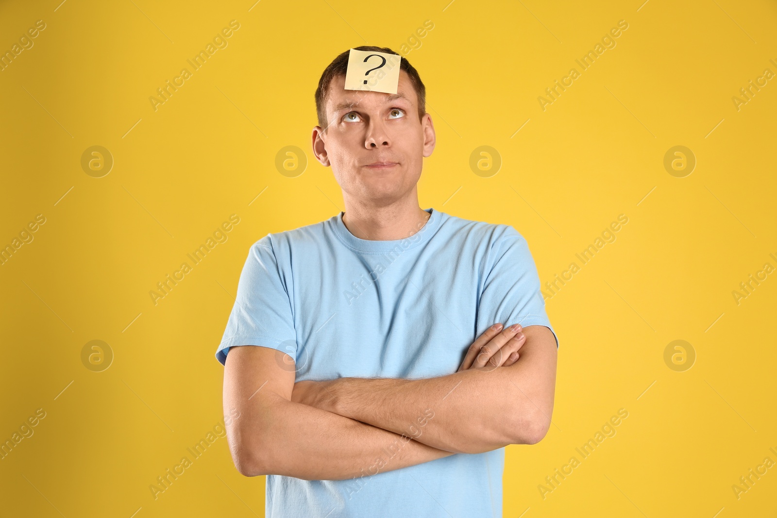 Photo of Emotional man with question mark on yellow  background