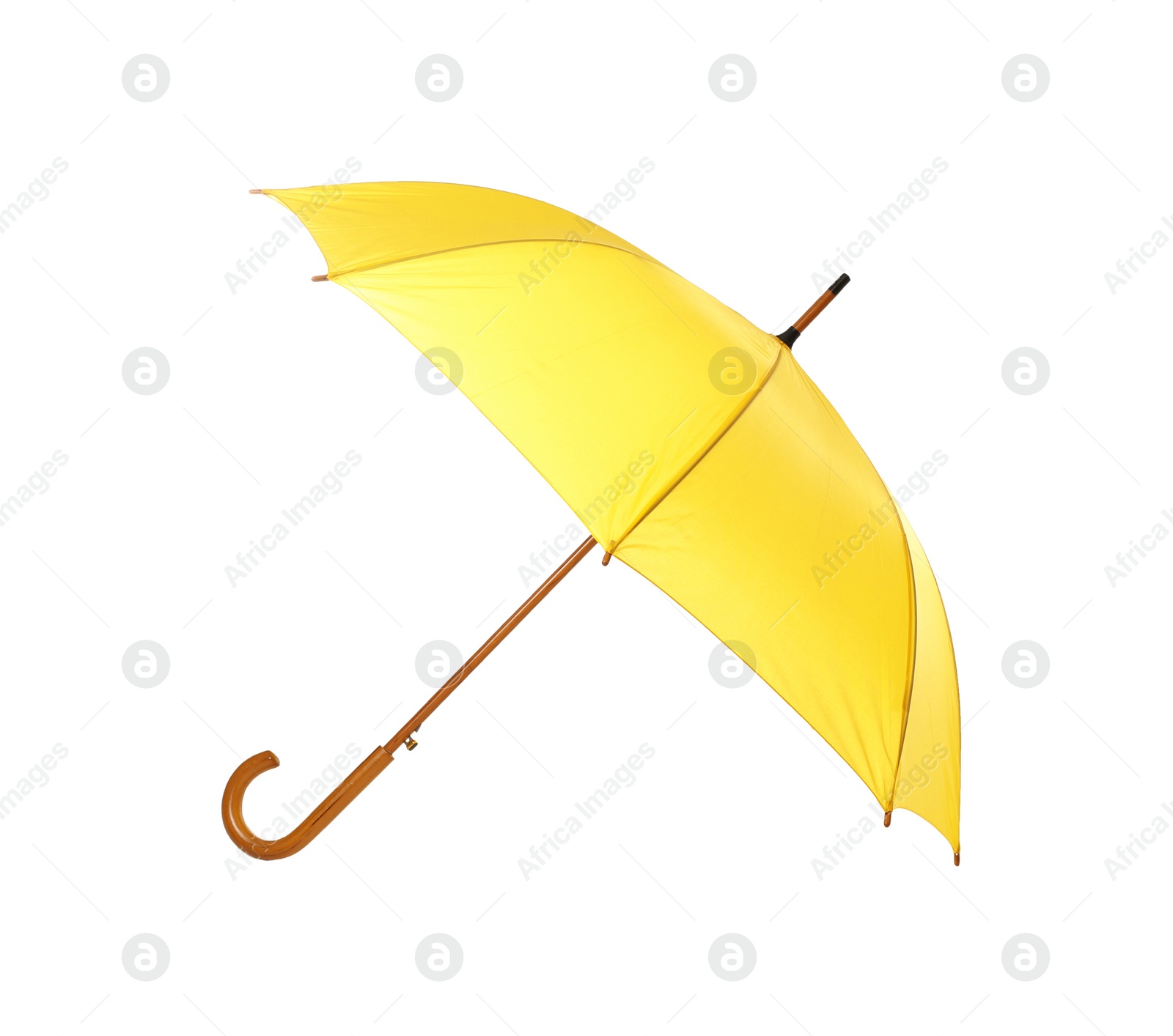 Photo of Modern opened yellow umbrella isolated on white