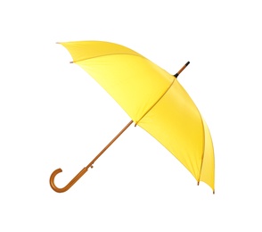 Photo of Modern opened yellow umbrella isolated on white