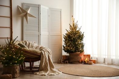 Photo of Stylish room interior with elegant Christmas decor