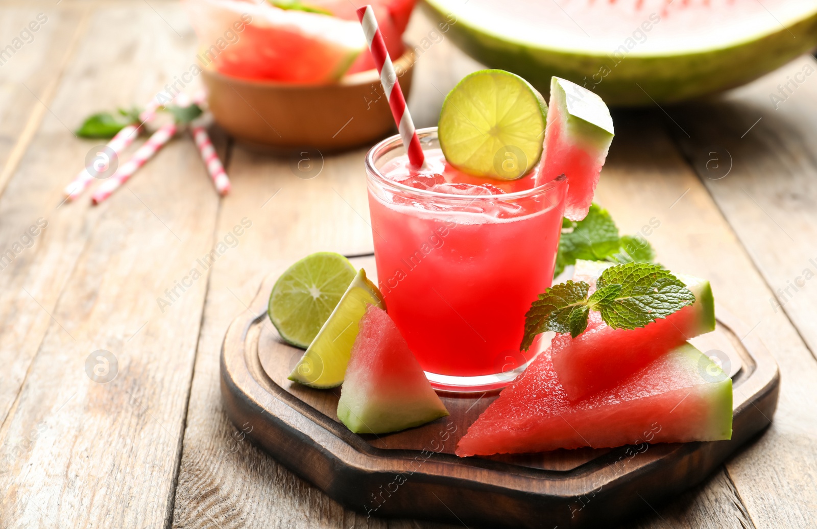 Photo of Delicious fresh watermelon drink on wooden table