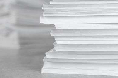 Photo of Stack of blank white paper on table, closeup. Space for text