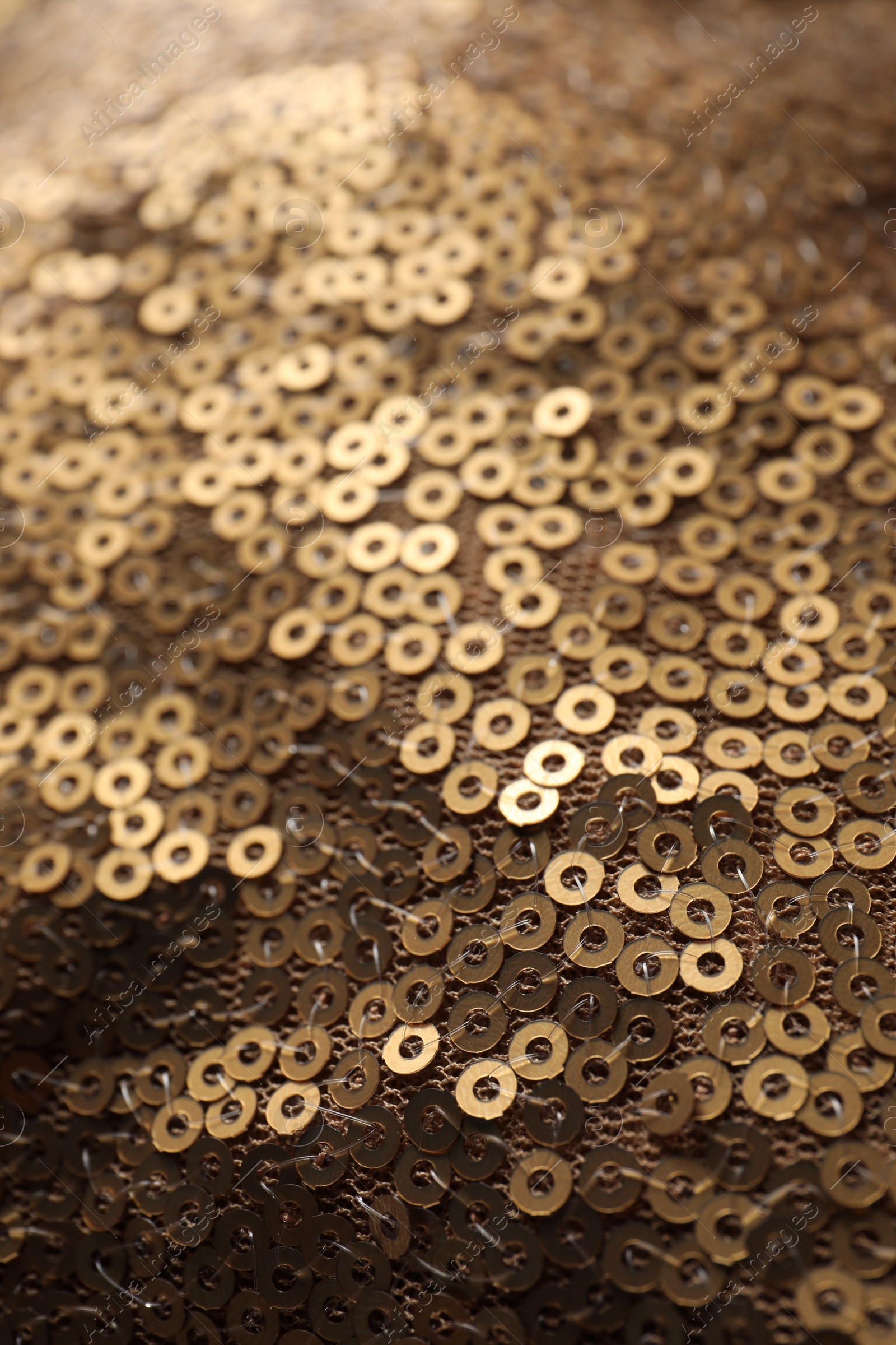 Photo of Beautiful golden sequin fabric as background, closeup