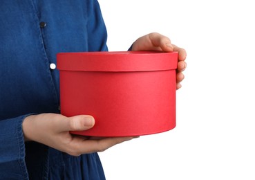 Photo of Woman holding red gift box on white background, closeup