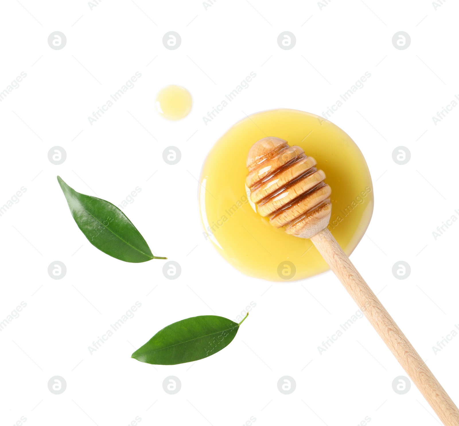 Photo of Wooden dipper with fresh honey and green leaves on white background, top view