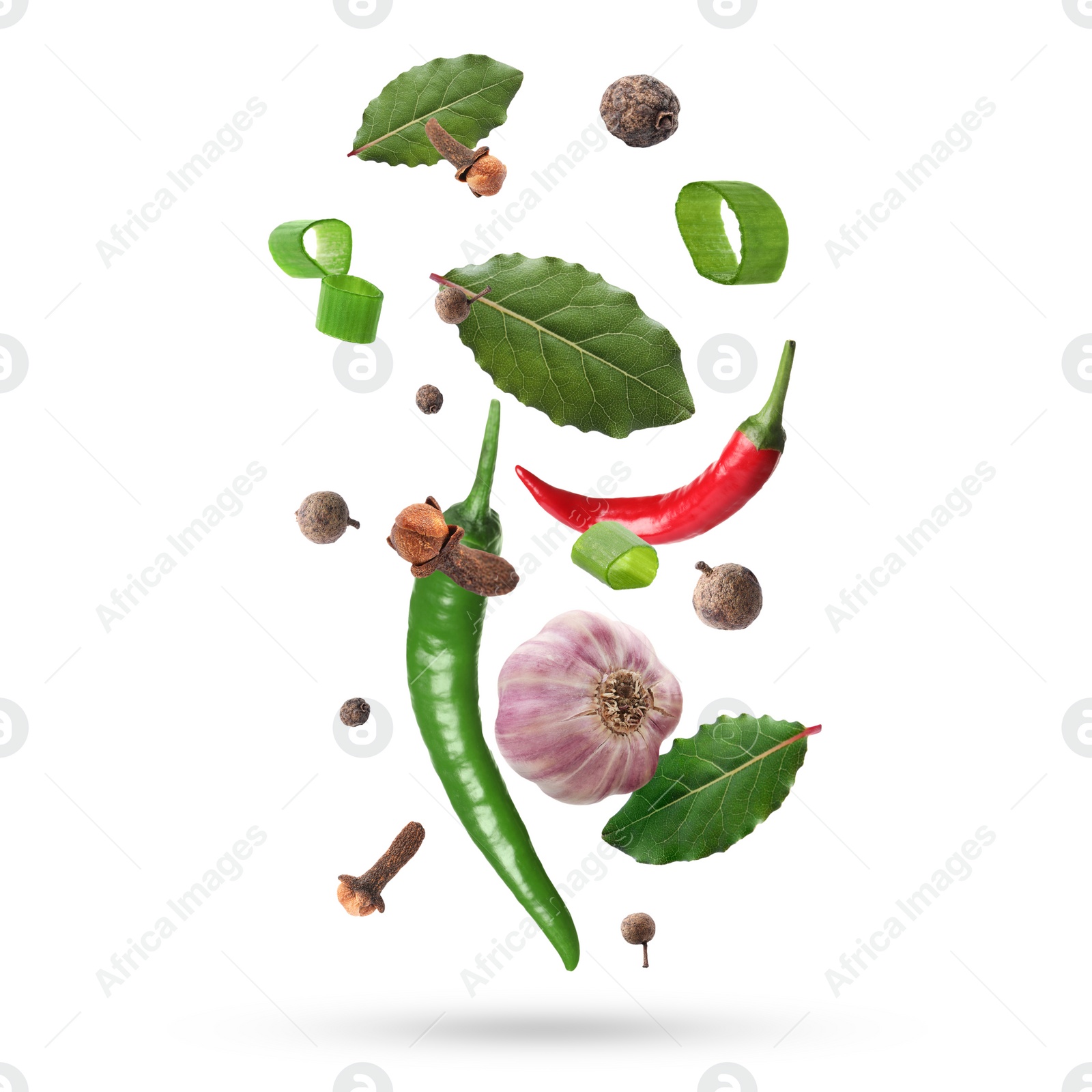 Image of Different aromatic spices falling on white background