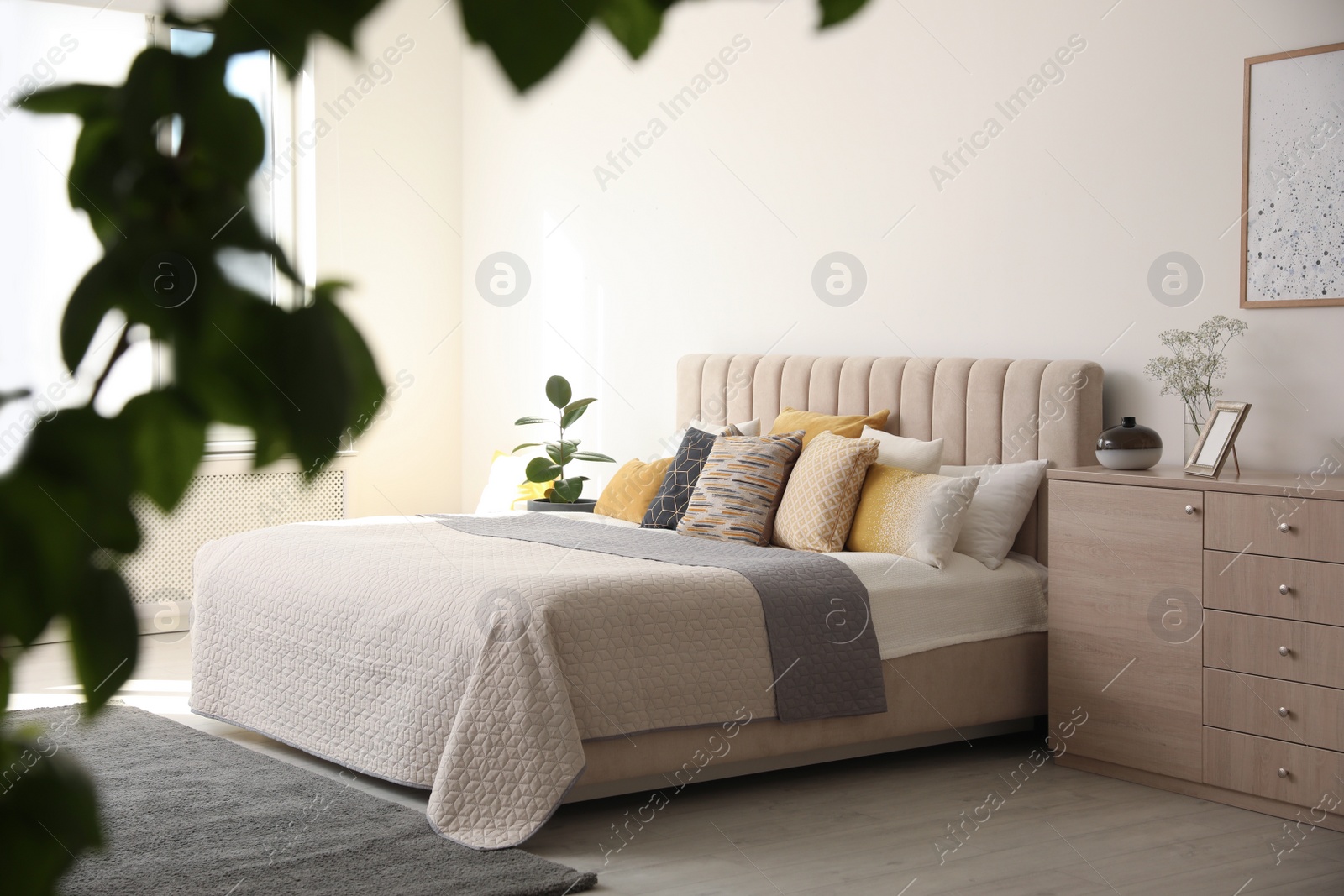 Photo of Stylish interior of contemporary room with comfortable bed