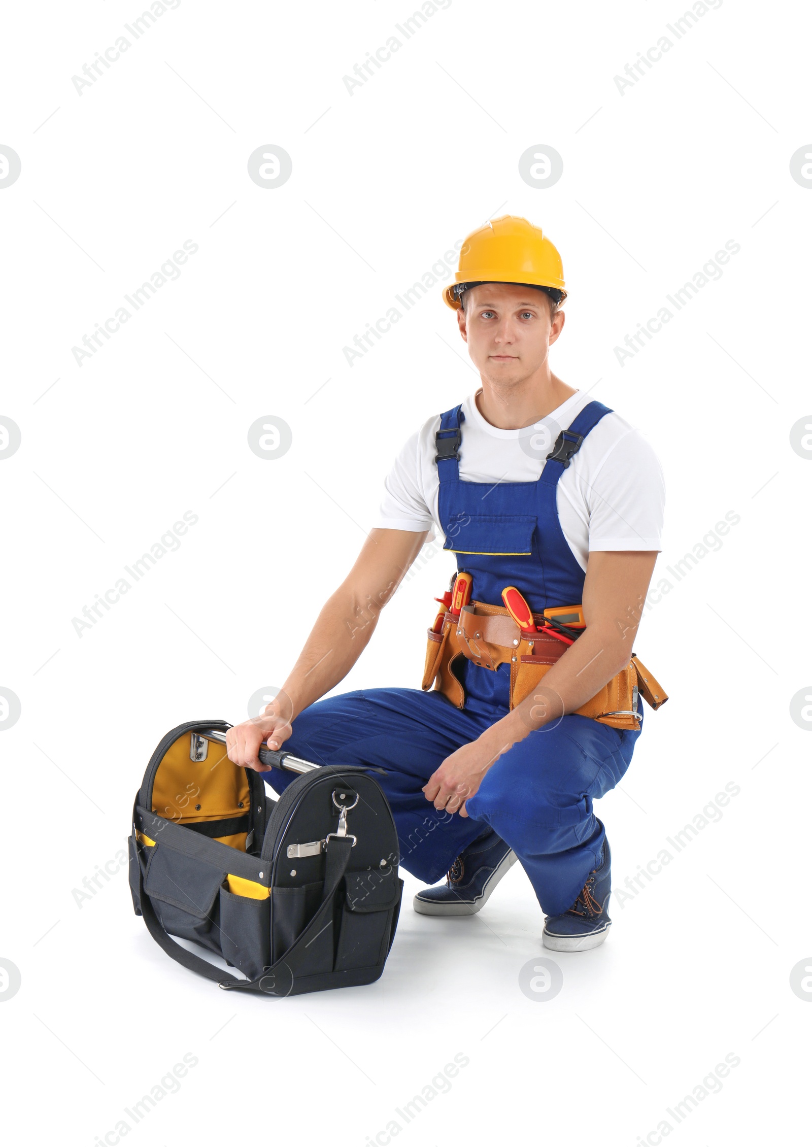 Photo of Electrician with tools wearing uniform on white background