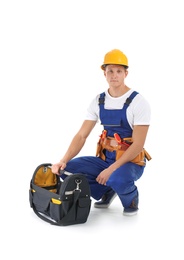 Electrician with tools wearing uniform on white background